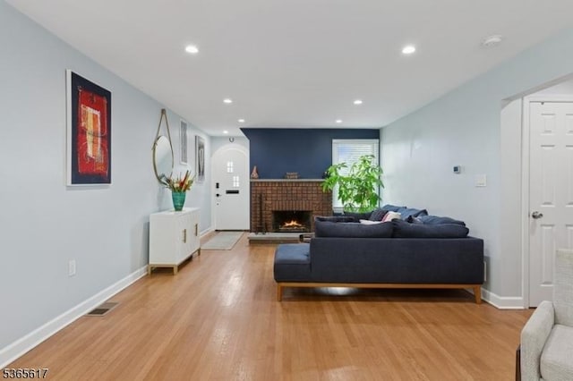 17 Lowell Ave, West Orange Twp, NJ 07052 - living room with light wood-style flooring, a brick fireplace, and recessed lighting