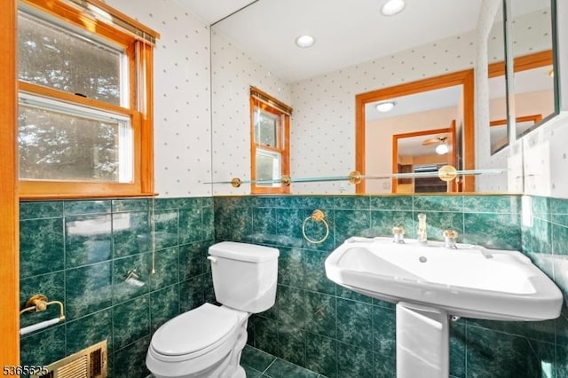 1265 Iris St, North Brunswick Twp, NJ 08902 - half bath featuring tile walls, a wainscoted wall, tile patterned floors, and wallpapered walls