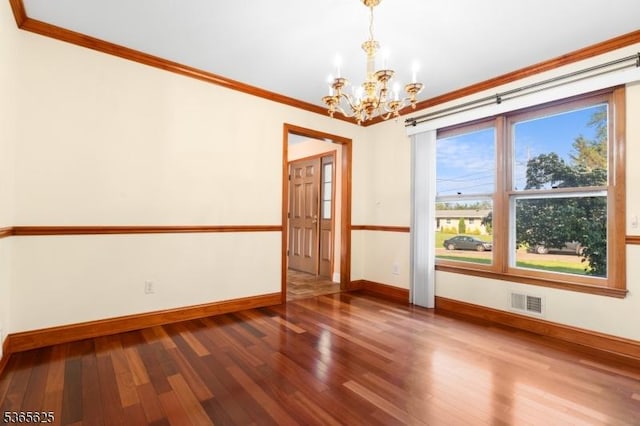 1265 Iris St, North Brunswick Twp, NJ 08902 - empty room featuring a chandelier, wood finished floors, and crown molding
