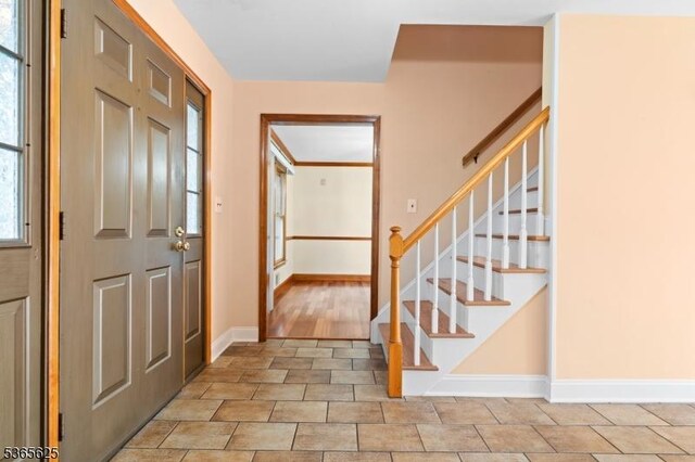 1265 Iris St, North Brunswick Twp, NJ 08902 - entrance foyer with baseboards and stairway