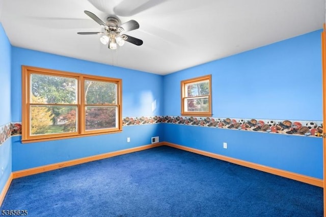 1265 Iris St, North Brunswick Twp, NJ 08902 - carpeted spare room featuring plenty of natural light and ceiling fan