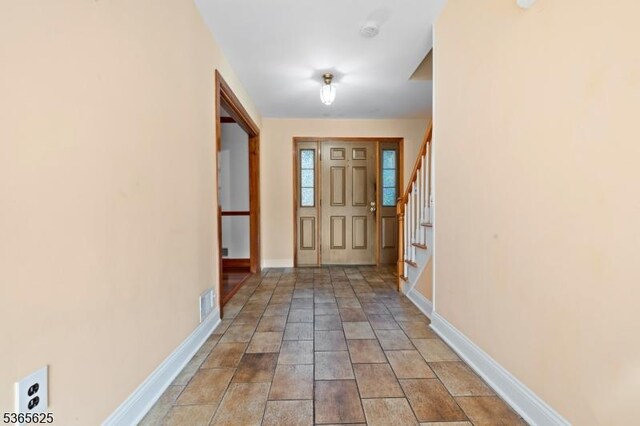 1265 Iris St, North Brunswick Twp, NJ 08902 - foyer entrance with stairs and stone finish flooring