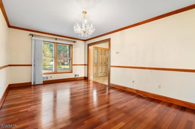 1265 Iris St, North Brunswick Twp, NJ 08902 - unfurnished room featuring a chandelier, hardwood / wood-style floors, and crown molding