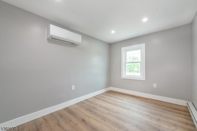 612 State Route 94, Fredon Twp, NJ 07860 - empty room featuring a wall mounted air conditioner, baseboard heating, recessed lighting, and wood finished floors