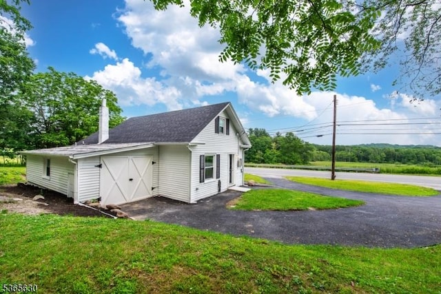 612 State Route 94, Fredon Twp, NJ 07860 - view of side of property with a lawn and a chimney