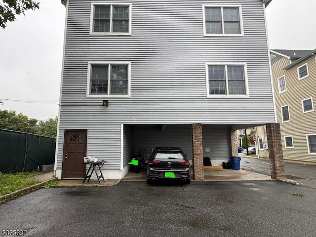 27 Sussex Ave Unit 1, Morristown Town, NJ 07960 - rear view of house featuring a carport and asphalt driveway