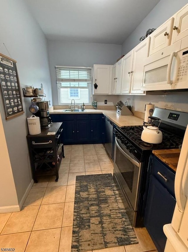 27 Sussex Ave Unit 1, Morristown Town, NJ 07960 - kitchen with stainless steel appliances, light tile patterned floors, white cabinetry, and dark cabinets