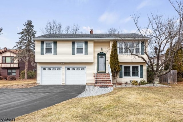 9 Village Ct, Flemington Boro, NJ 08822 - bi-level home featuring asphalt driveway, a chimney, an attached garage, and a front lawn
