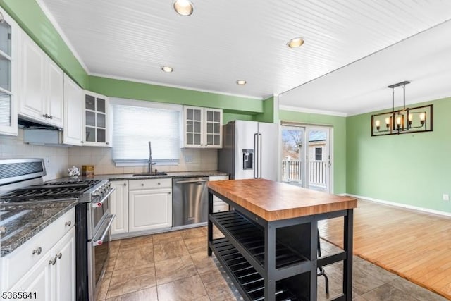 9 Village Ct, Flemington Boro, NJ 08822 - kitchen featuring appliances with stainless steel finishes, white cabinetry, glass insert cabinets, tasteful backsplash, and crown molding