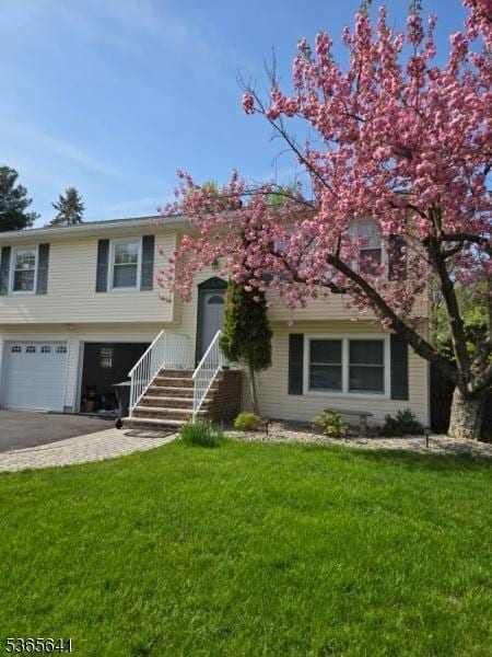 9 Village Ct, Flemington Boro, NJ 08822 - view of front of house featuring an attached garage, asphalt driveway, and a front yard