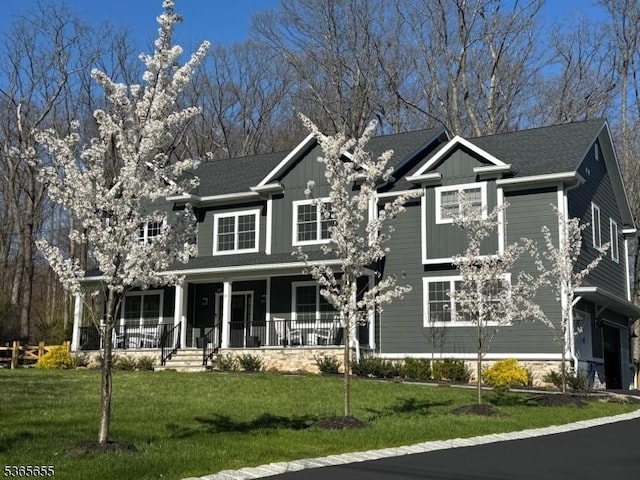 93 Morristown Rd, Long Hill Twp, NJ 07933 - view of front of house featuring covered porch, a front lawn, and board and batten siding
