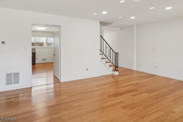 922C Merritt Dr, Hillsborough Twp, NJ 08844 - unfurnished room featuring light wood finished floors, stairs, and recessed lighting