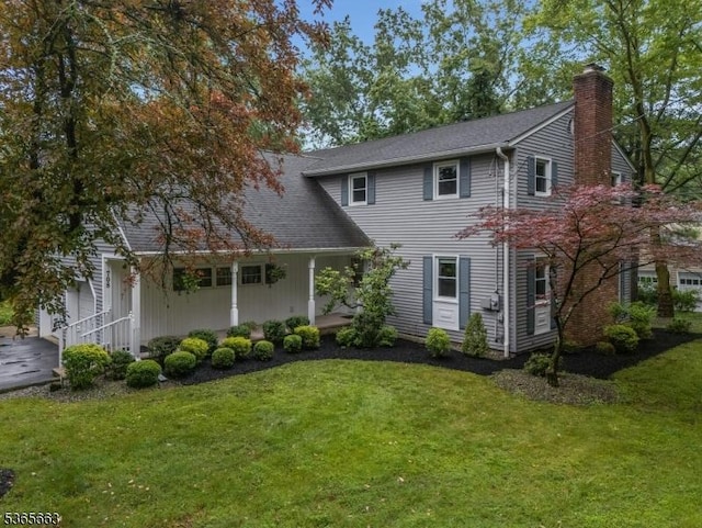 708 Carlene Dr, Bridgewater Twp, NJ 08807 - back of property featuring a chimney, a lawn, roof with shingles, and covered porch