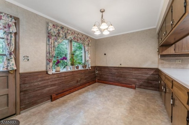 708 Carlene Dr, Bridgewater Twp, NJ 08807 - unfurnished dining area featuring a chandelier, light flooring, crown molding, and wainscoting