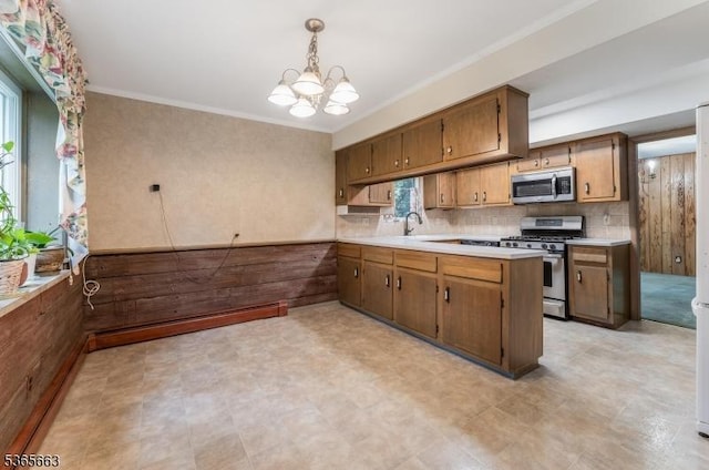 708 Carlene Dr, Bridgewater Twp, NJ 08807 - kitchen featuring stainless steel appliances, a chandelier, a peninsula, light countertops, and tasteful backsplash