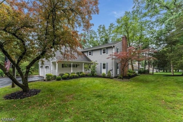 708 Carlene Dr, Bridgewater Twp, NJ 08807 - view of front of home with a chimney, a front yard, and concrete driveway