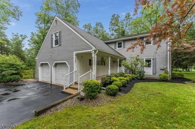 708 Carlene Dr, Bridgewater Twp, NJ 08807 - view of front of property with driveway, a front yard, an attached garage, and a porch