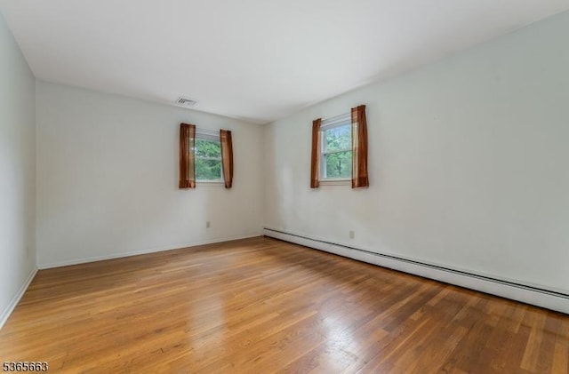 708 Carlene Dr, Bridgewater Twp, NJ 08807 - unfurnished room with baseboard heating and light wood finished floors