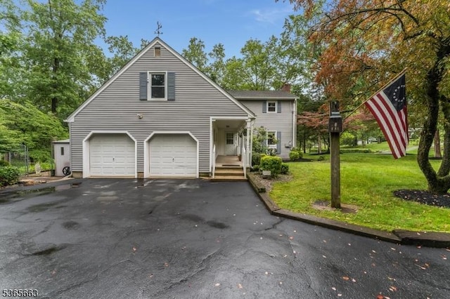 708 Carlene Dr, Bridgewater Twp, NJ 08807 - view of front facade featuring an attached garage, asphalt driveway, a chimney, and a front yard