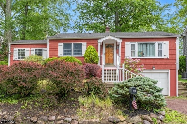 16 Ridgewood Pkwy W, Denville Twp, NJ 07834 - ranch-style house featuring a garage, a chimney, and driveway