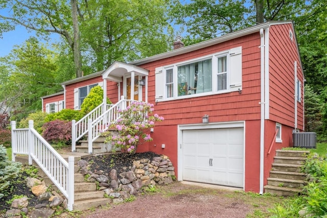 16 Ridgewood Pkwy W, Denville Twp, NJ 07834 - ranch-style house with a garage, stairs, driveway, and a chimney