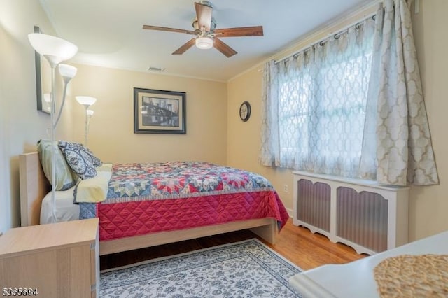 16 Ridgewood Pkwy W, Denville Twp, NJ 07834 - bedroom with radiator, wood finished floors, crown molding, and a ceiling fan