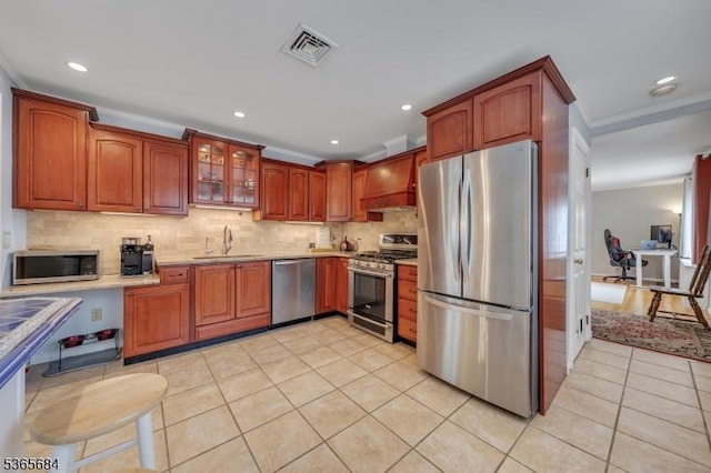 16 Ridgewood Pkwy W, Denville Twp, NJ 07834 - kitchen with stainless steel appliances, light tile patterned flooring, light countertops, decorative backsplash, and glass insert cabinets