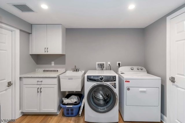 6 Wyckoff Way, Morris Plains Boro, NJ 07950 - washroom featuring washing machine and dryer, cabinet space, light wood-style flooring, and recessed lighting