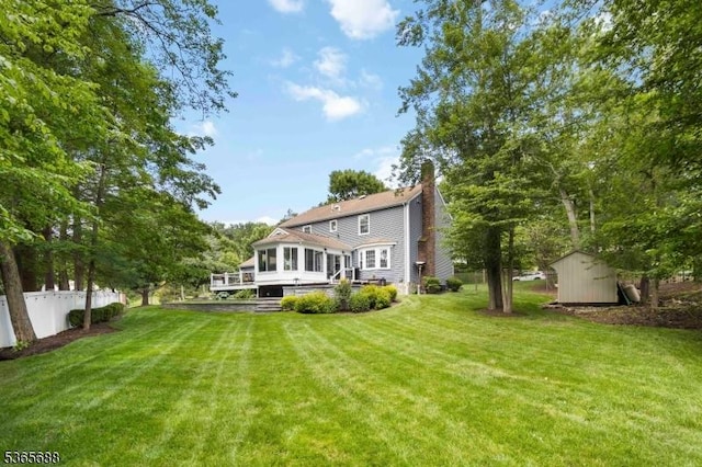 6 Wyckoff Way, Morris Plains Boro, NJ 07950 - rear view of house featuring a storage shed, a chimney, and a sunroom
