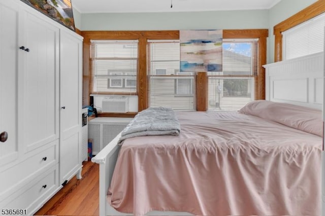 23 Brookside Ave, Hawthorne Boro, NJ 07506 - bedroom featuring radiator, wood finished floors, ornamental molding, and cooling unit