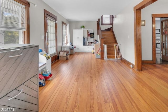 23 Brookside Ave, Hawthorne Boro, NJ 07506 - unfurnished living room with wood finished floors, plenty of natural light, and stairway