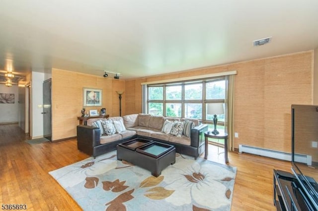 9 Andrea Ter, East Hanover Twp, NJ 07936 - living room with baseboard heating and light wood-style floors