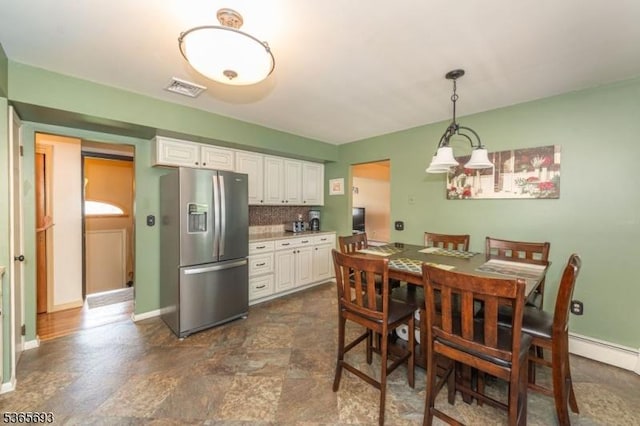 9 Andrea Ter, East Hanover Twp, NJ 07936 - dining space with stone finish flooring and a chandelier