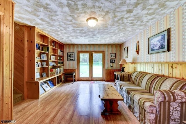 508 Stony Brook Dr, Bridgewater Twp, NJ 08807 - living room with wallpapered walls, wood finished floors, a wainscoted wall, and wooden walls