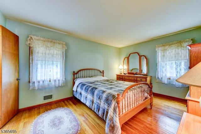 508 Stony Brook Dr, Bridgewater Twp, NJ 08807 - bedroom featuring multiple windows and wood finished floors