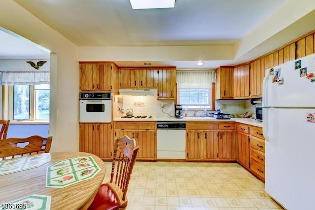 508 Stony Brook Dr, Bridgewater Twp, NJ 08807 - kitchen with white appliances, under cabinet range hood, light countertops, light flooring, and recessed lighting