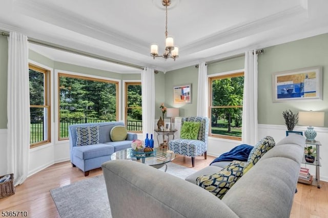 6 White Rd, Raritan Twp, NJ 08822 - living area featuring ornamental molding, a chandelier, light wood-style floors, and a tray ceiling