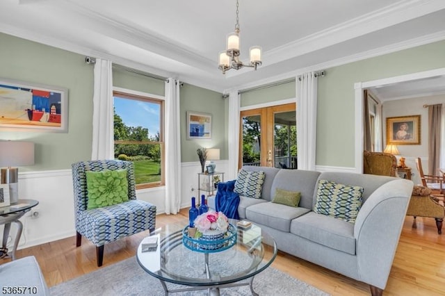 6 White Rd, Raritan Twp, NJ 08822 - living area featuring plenty of natural light, french doors, ornamental molding, light wood-style floors, and a chandelier