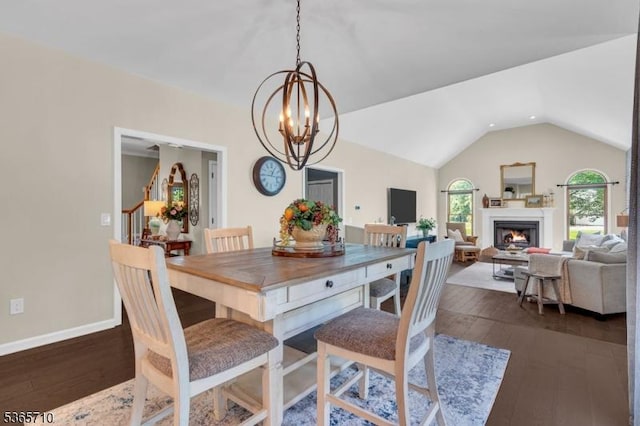 6 White Rd, Raritan Twp, NJ 08822 - dining space featuring a chandelier, lofted ceiling, dark wood finished floors, and a warm lit fireplace