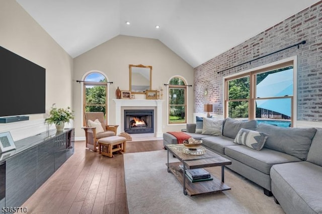 6 White Rd, Raritan Twp, NJ 08822 - living room with high vaulted ceiling, a fireplace with flush hearth, healthy amount of natural light, and light wood-style floors