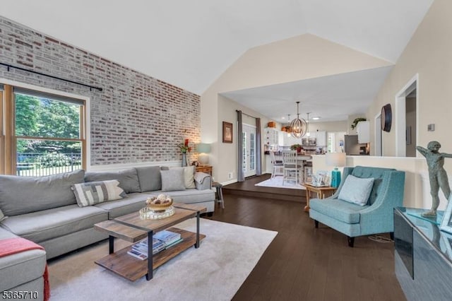 6 White Rd, Raritan Twp, NJ 08822 - living room featuring a chandelier, brick wall, hardwood / wood-style flooring, and high vaulted ceiling