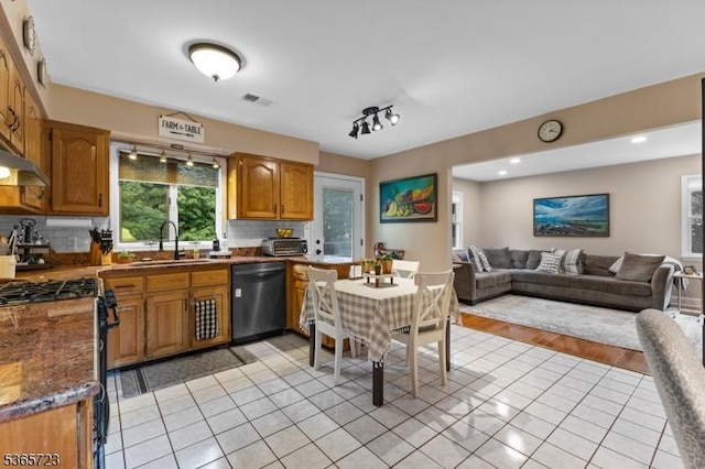 825 Odonnell Ave, Scotch Plains Twp, NJ 07076 - kitchen featuring appliances with stainless steel finishes, backsplash, open floor plan, light tile patterned flooring, and brown cabinets