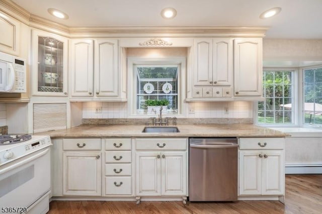 73 Garden Ave, Chatham Boro, NJ 07928 - kitchen with white appliances, healthy amount of natural light, a baseboard radiator, and decorative backsplash
