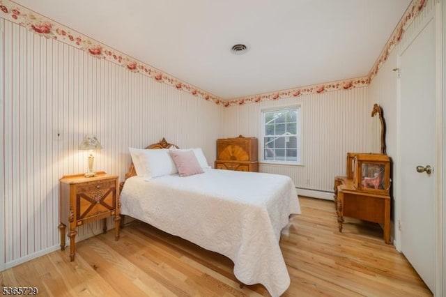 73 Garden Ave, Chatham Boro, NJ 07928 - bedroom with light wood finished floors and baseboard heating