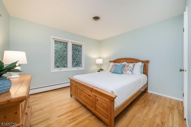 73 Garden Ave, Chatham Boro, NJ 07928 - bedroom featuring baseboard heating and light wood-type flooring