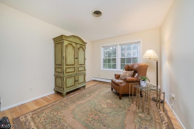 73 Garden Ave, Chatham Boro, NJ 07928 - living area with baseboard heating and light wood-style flooring