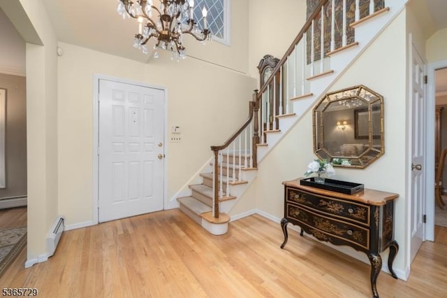 73 Garden Ave, Chatham Boro, NJ 07928 - entrance foyer with stairway, wood finished floors, a chandelier, and a baseboard radiator