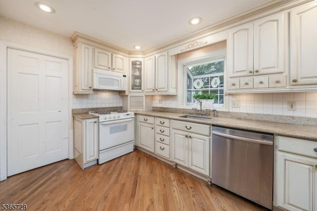 73 Garden Ave, Chatham Boro, NJ 07928 - kitchen with white appliances, tasteful backsplash, light wood-style floors, glass insert cabinets, and recessed lighting