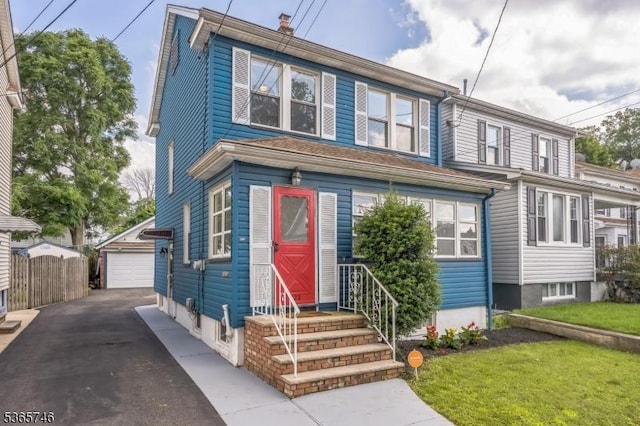 522 Locust Ave, Hillside Twp, NJ 07205 - view of front of home with entry steps, an outdoor structure, and a detached garage