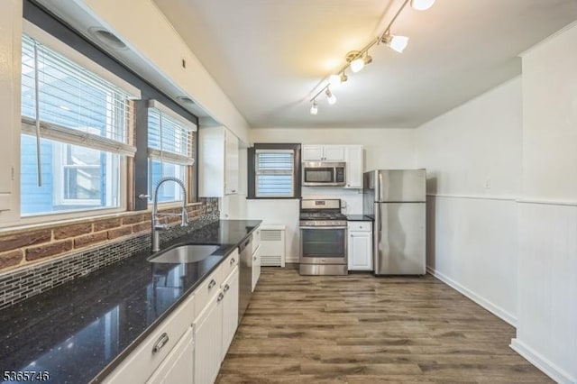 522 Locust Ave, Hillside Twp, NJ 07205 - kitchen featuring stainless steel appliances, white cabinetry, dark stone countertops, dark wood-style flooring, and tasteful backsplash